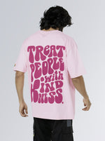 Load image into Gallery viewer, Be Kind Soft Pink Unisex Oversized T Shirt back design view of male