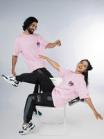 Load image into Gallery viewer, Eye for an Eye Soft Pink Unisex Oversized T-Shirt Front Design View Of Male and Female
