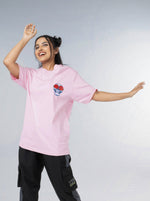 Load image into Gallery viewer, Eye for an Eye Soft Pink Unisex Oversized T-Shirt Front  Design View Of Female