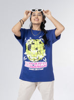 Load image into Gallery viewer, Kindness Growing Royal Blue Unisex Oversized T Shirt Front Design view of Female