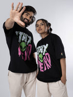Load image into Gallery viewer, Stay Weird - Black Oversized T-Shirt Front View of male and female