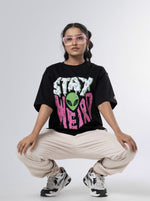 Load image into Gallery viewer, Stay Weird - Black Oversized T-Shirt Front View of female