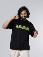 Load image into Gallery viewer, Marijuana Black Unisex Oversized T Shirt front design view of male