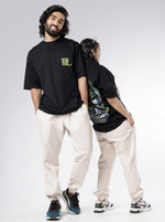 Load image into Gallery viewer, Master Hunter Black  Unisex Oversized T-Shirt Front and Back View of Male and Female