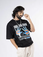 Load image into Gallery viewer, Feel the Pain Black Unisex Oversized T-Shirt Front View Of Male
