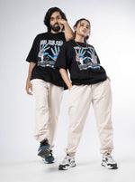 Load image into Gallery viewer, Feel the Pain Black Unisex Oversized T-Shirt Front View Of Male and Female
