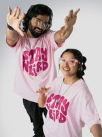 Load image into Gallery viewer, Stay Weird Soft Pink Unisex Oversized T-Shirt Front View Of Male and Female