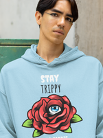 Load image into Gallery viewer, Man wearing a Stay Trippy   – Baby Blue Unisex Printed Hoodie
