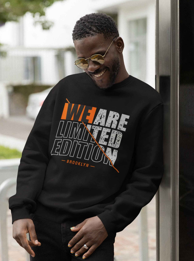 Man wearing a We are Limited Edition - Black Unisex Printed Sweatshirt