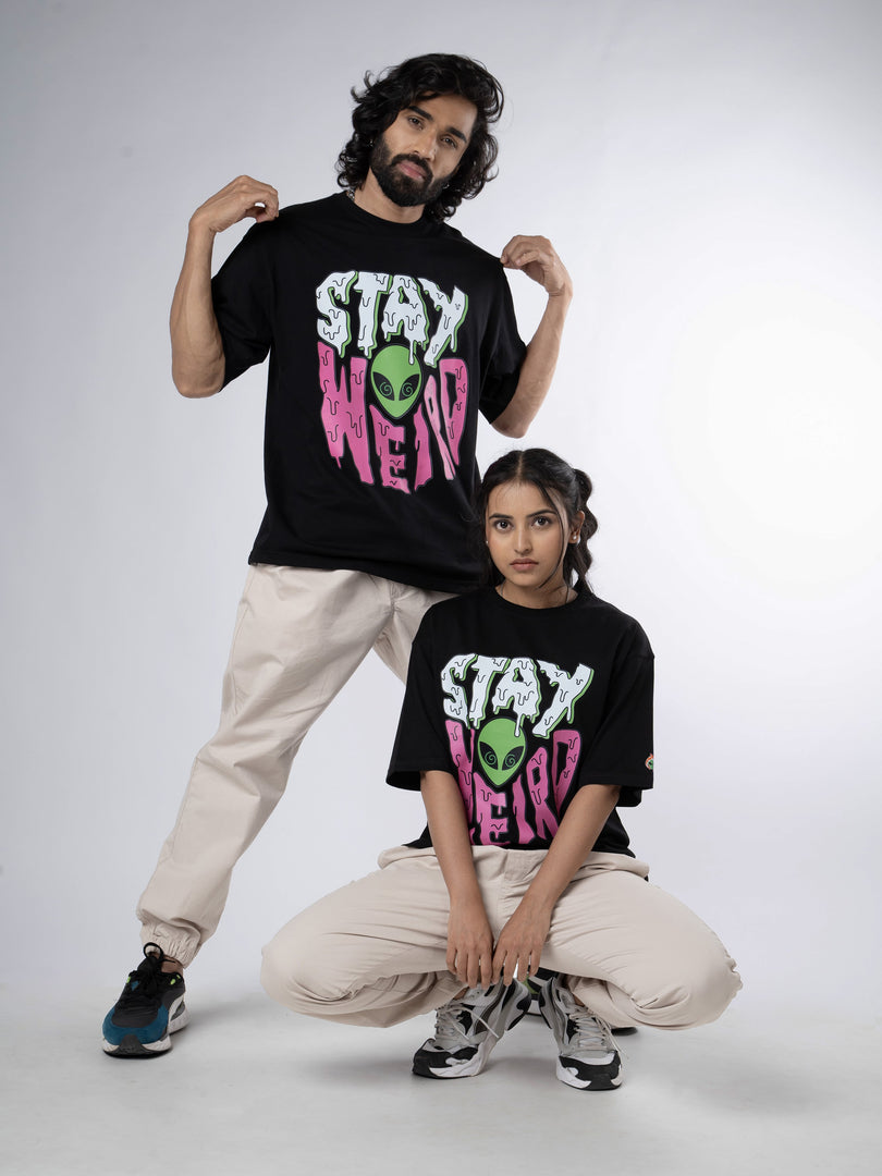 Stay Weird - Black Oversized T-Shirt Front View of male and female