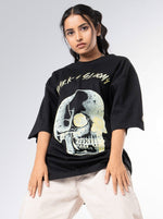 Load image into Gallery viewer, Dark and Gloomy Black Unisex Oversized T-Shirt Front View Of Female
