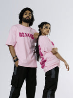 Load image into Gallery viewer, Be Kind Soft Pink Unisex Oversized T Shirt front and back design view of male and female 
